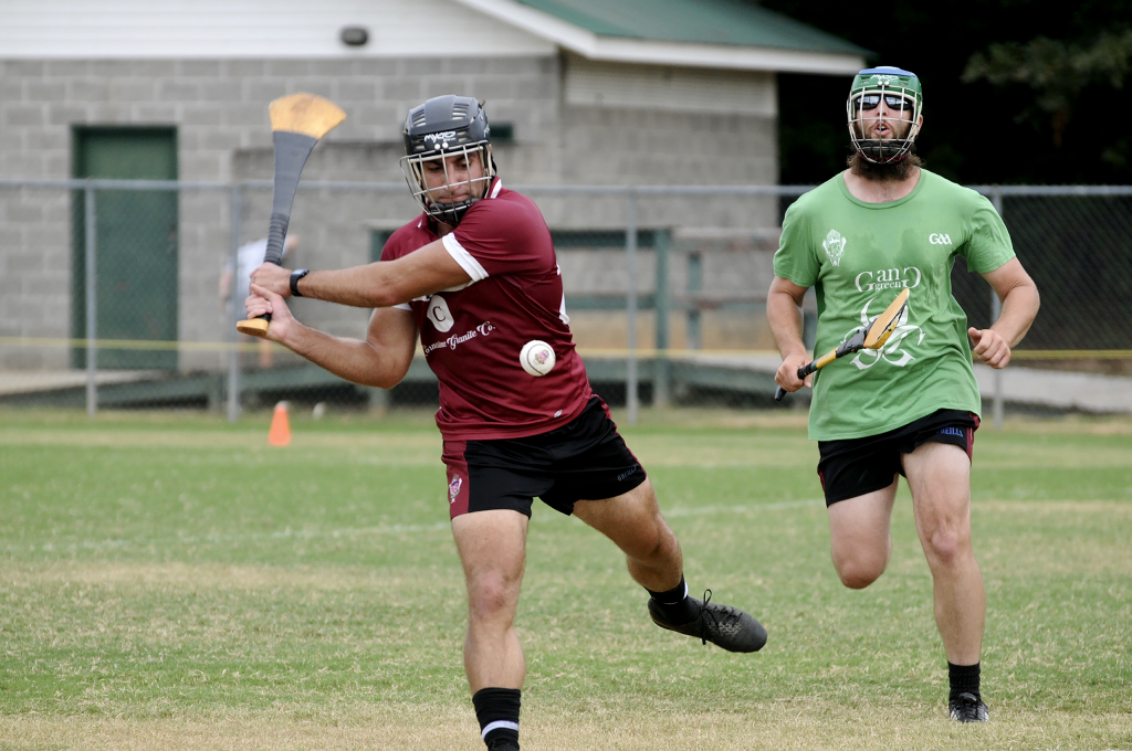 Erik McTaggart (maroon jersey) shoots for a point as Garrett Dorn attempts to chase him down. Photo courtesy Erika Knight.