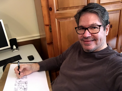 Rick McKee sits with his sketches at his desk. The former editorial cartoonist with "The Augusta Chronicle" has created a new comic strip, "Mt. Pleasant," which launched in newspapers
