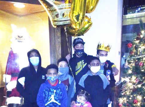 Dennis Murray is shown Dec. 11 (holding the ballons) for his other son’s birthday. His trip to the Stars & Strikes for his 13-year-old son’s birthday on Dec. 26 ended in a shooting.