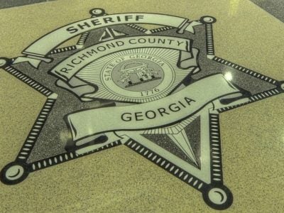 Taxpayers are on the hook for $450,000 almost 10 years after a sheriff's deputy racing to a bank robbery t-boned a woman's car.