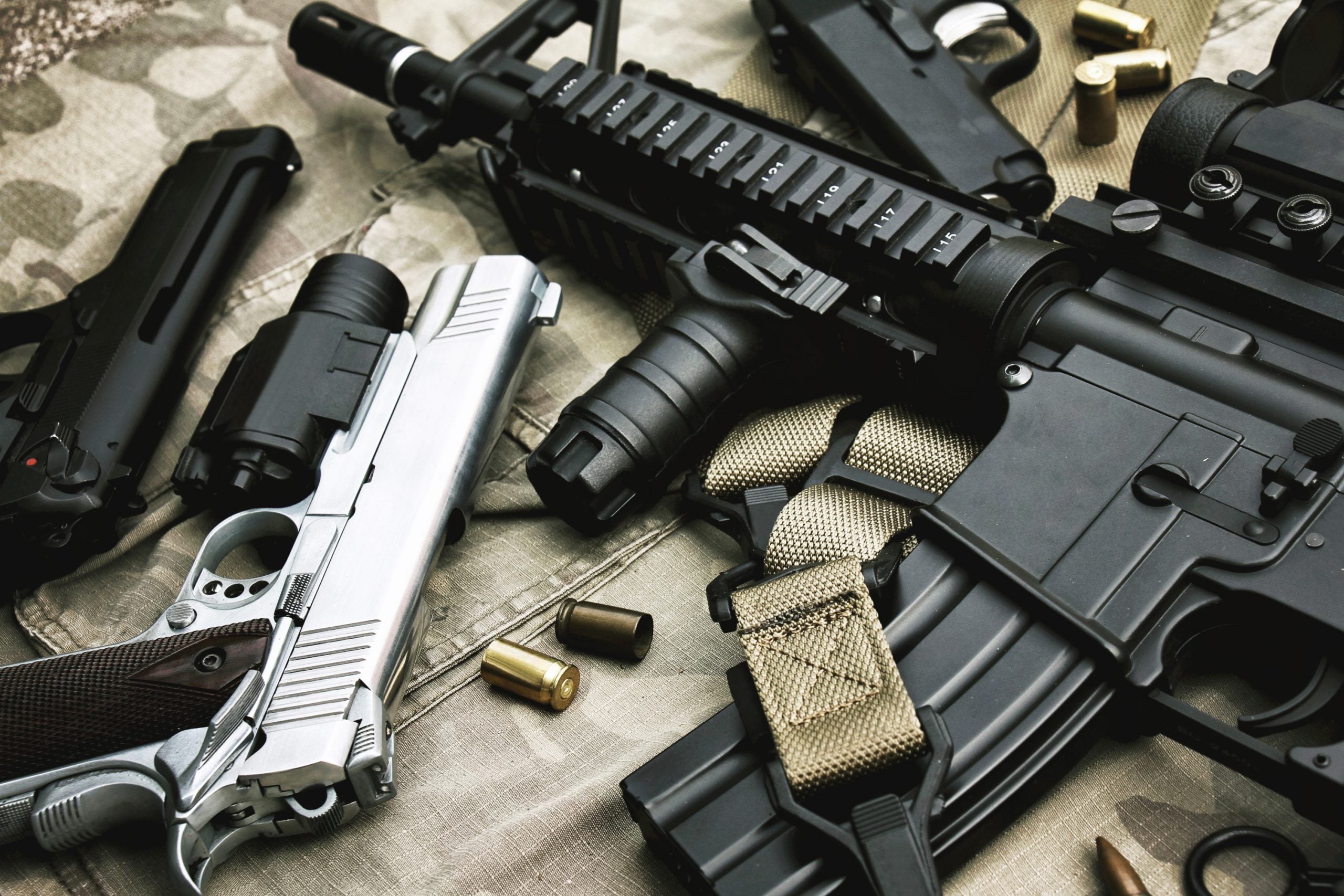 Machine guns and silencers were among the devices that got area convicted felons indicted and sentenced this month in U.S. District Court. Photo credit: Artfully79 courtesy istock.com