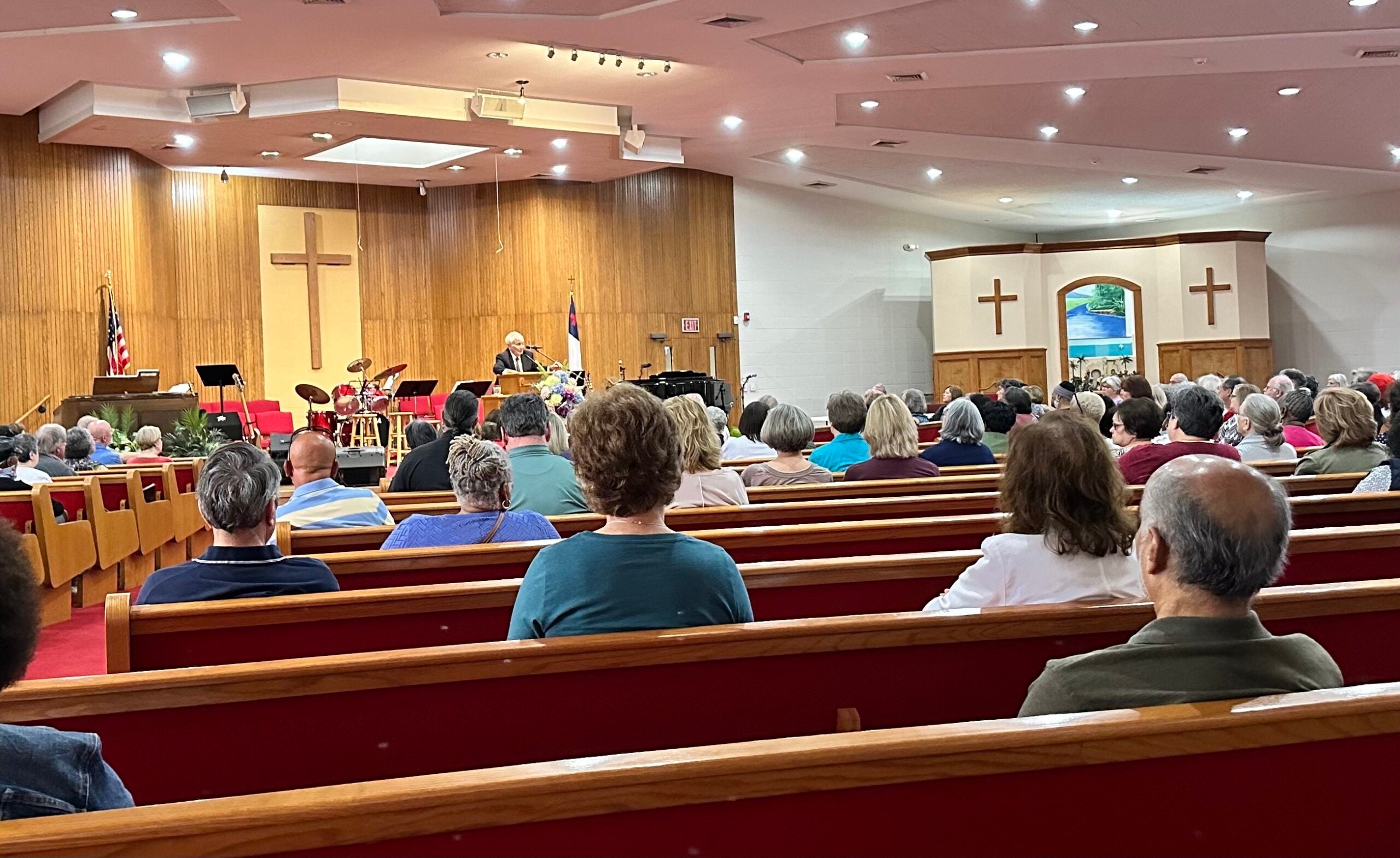 Some 174 University Hospital-Piedmont retirees meet with attorney Jack Long to discuss a lawsuit against the hospital to block it from stopping a promised lifetime benefit.
