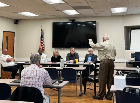 Gary Coker, right, describes Central EMS's plan to serve Augusta to a regional EMS committee Feb. 15. The committee recommended Central over current provider Gold Cross.