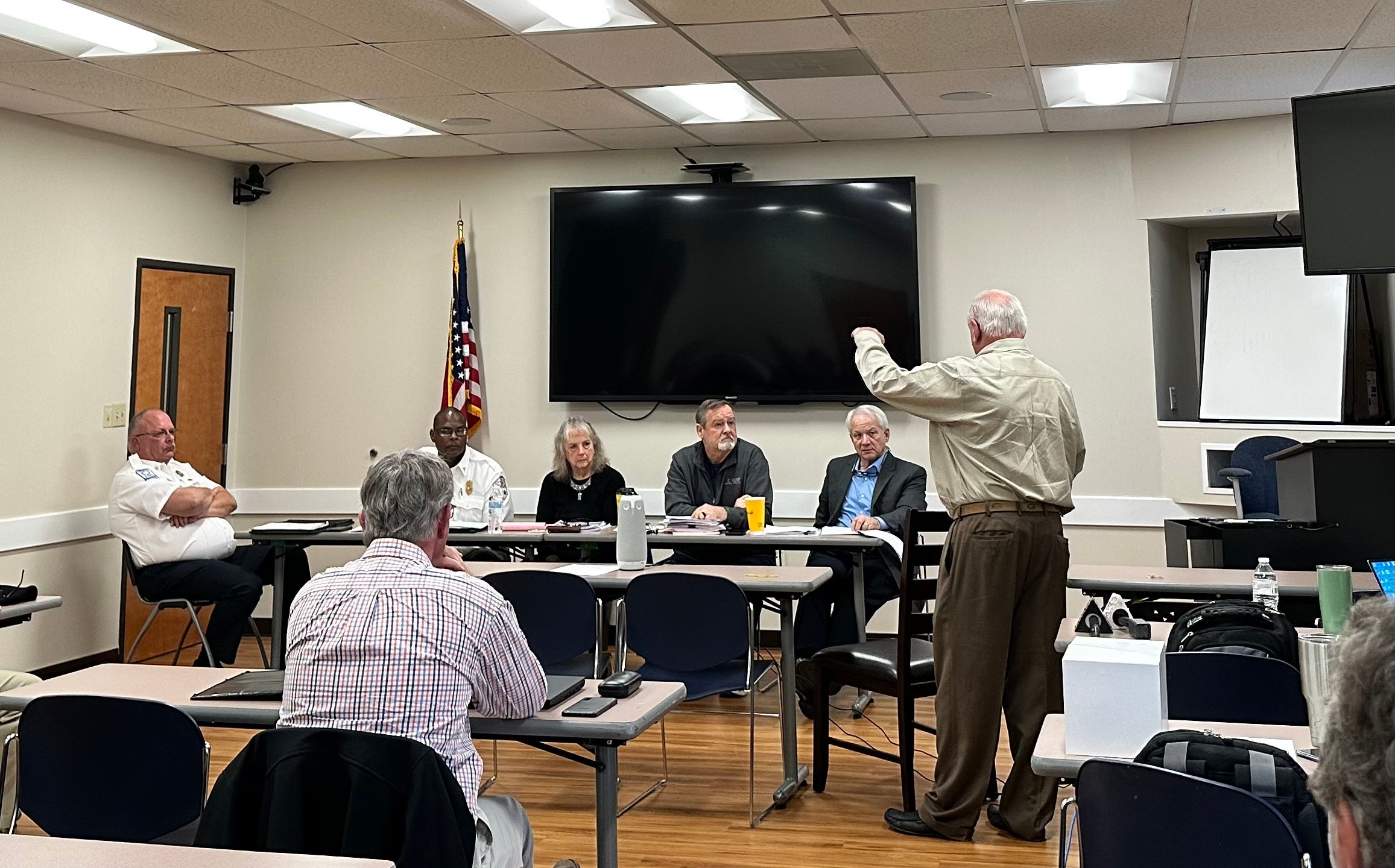 Gary Coker, right, describes Central EMS's plan to serve Augusta to a regional EMS committee Feb. 15. The committee recommended Central over current provider Gold Cross.