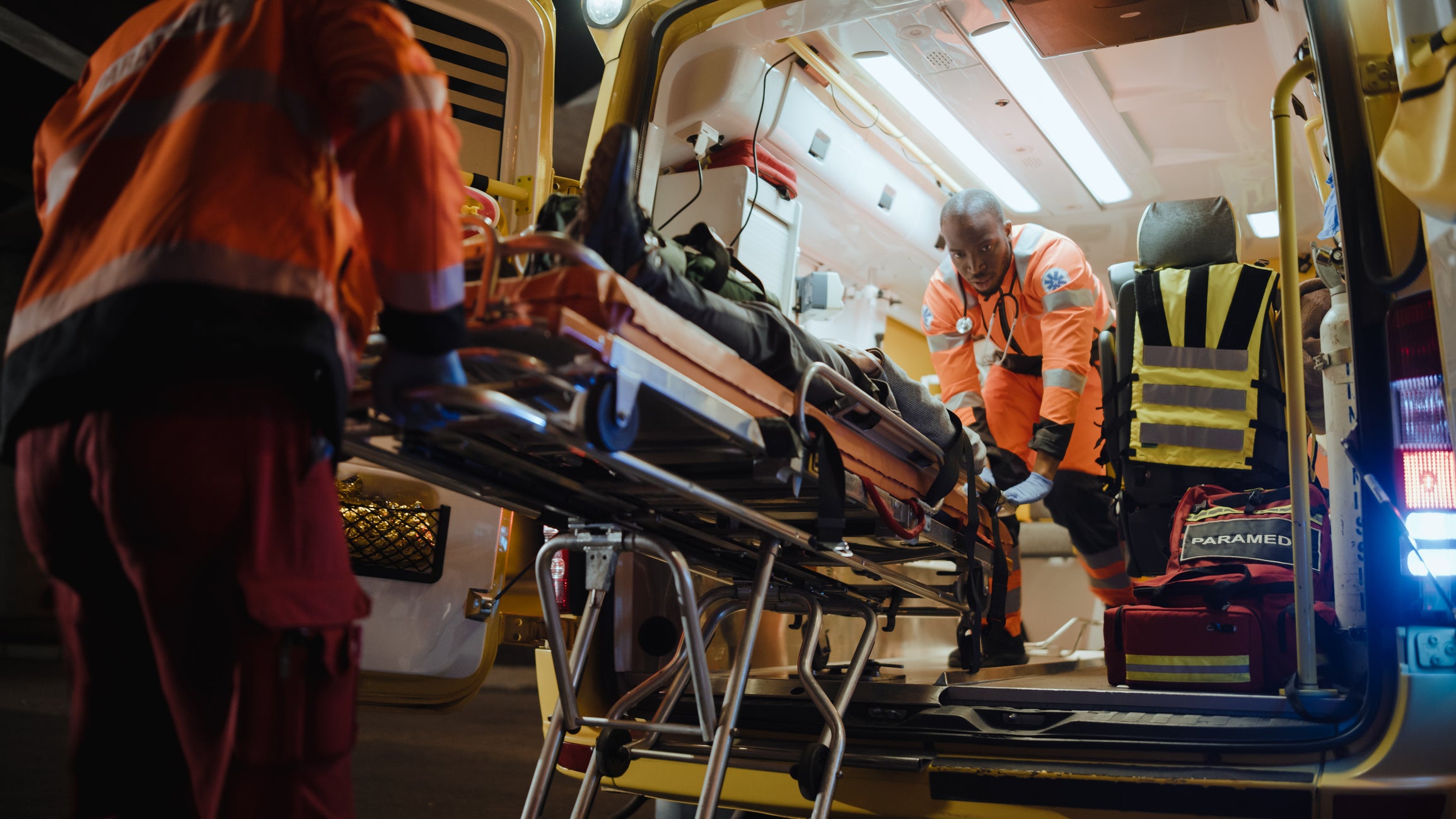 Paramedics remove a patient from an ambulance. Three companies including Augusta's current provider Gold Cross have submitted bids to run the city's EMS calls.