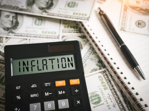 INFLATION word on calculator in idea for FED consider interest rate hike, world economics and inflation control, US dollar inflation