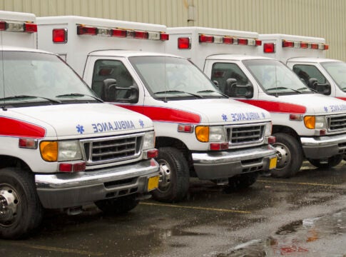 A fleet of ambulances is parked outside a hospital. Augusta is one of a handful of places in Georgia where ambulance service is controlled by a private provider.