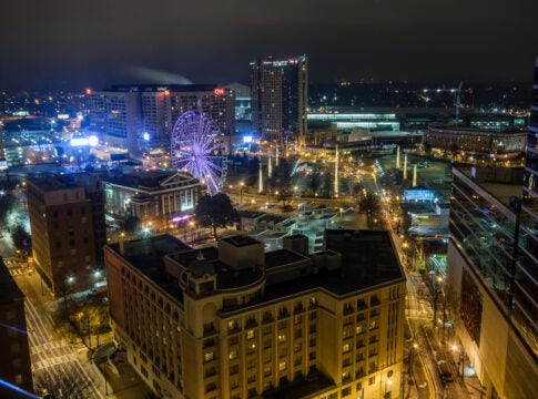 Aerial night view to CNN Center, Philips Arena and Omni Hotel in Atlanta.