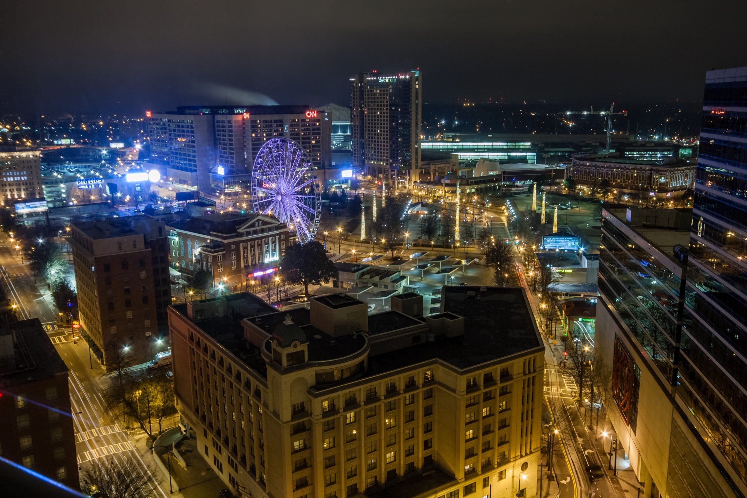 Aerial night view to CNN Center, Philips Arena and Omni Hotel in Atlanta.