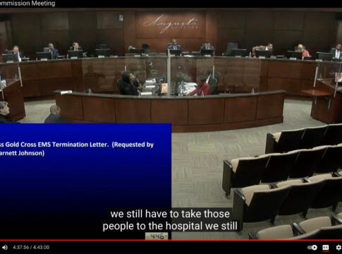 Central EMS CEO Gary Coker, right, speaks to the Augusta Commission during a lively question-and-answer session Wednesday.