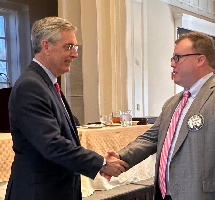 Georgia Secretary of State Brad Raffensperger, left, shakes hands with attorney Charles Rollins after speaking to the Kiwanis Club of Augusta Monday at St. Paul's Church.