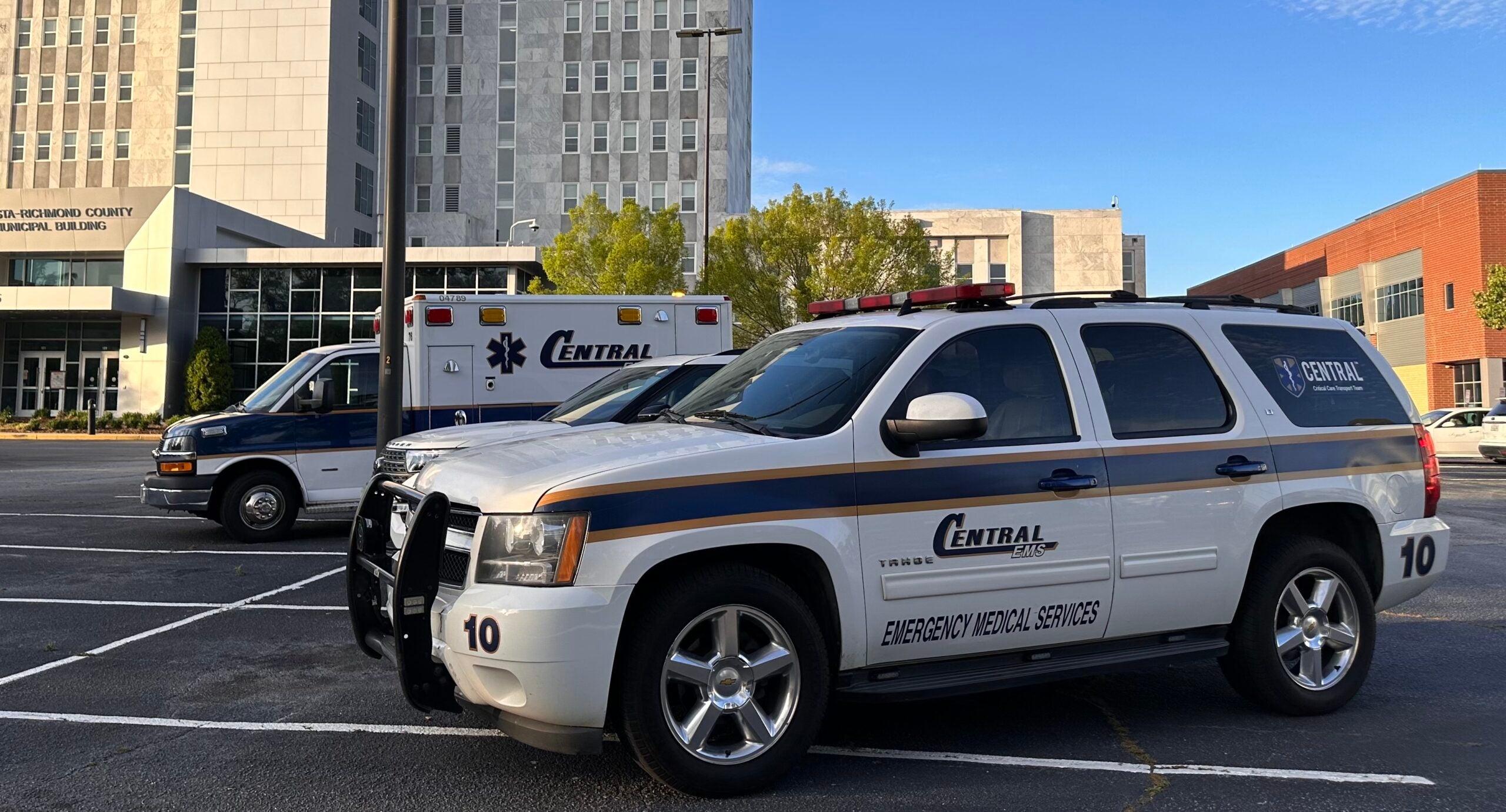Central EMS and quick-response vehicles, or QRVs, parked at Augusta Municipal Building for an April 2 news conference. The Augusta firefighters' association is urging the Augusta Commission to approve a "reasonable subsidy" for the city's new provider.