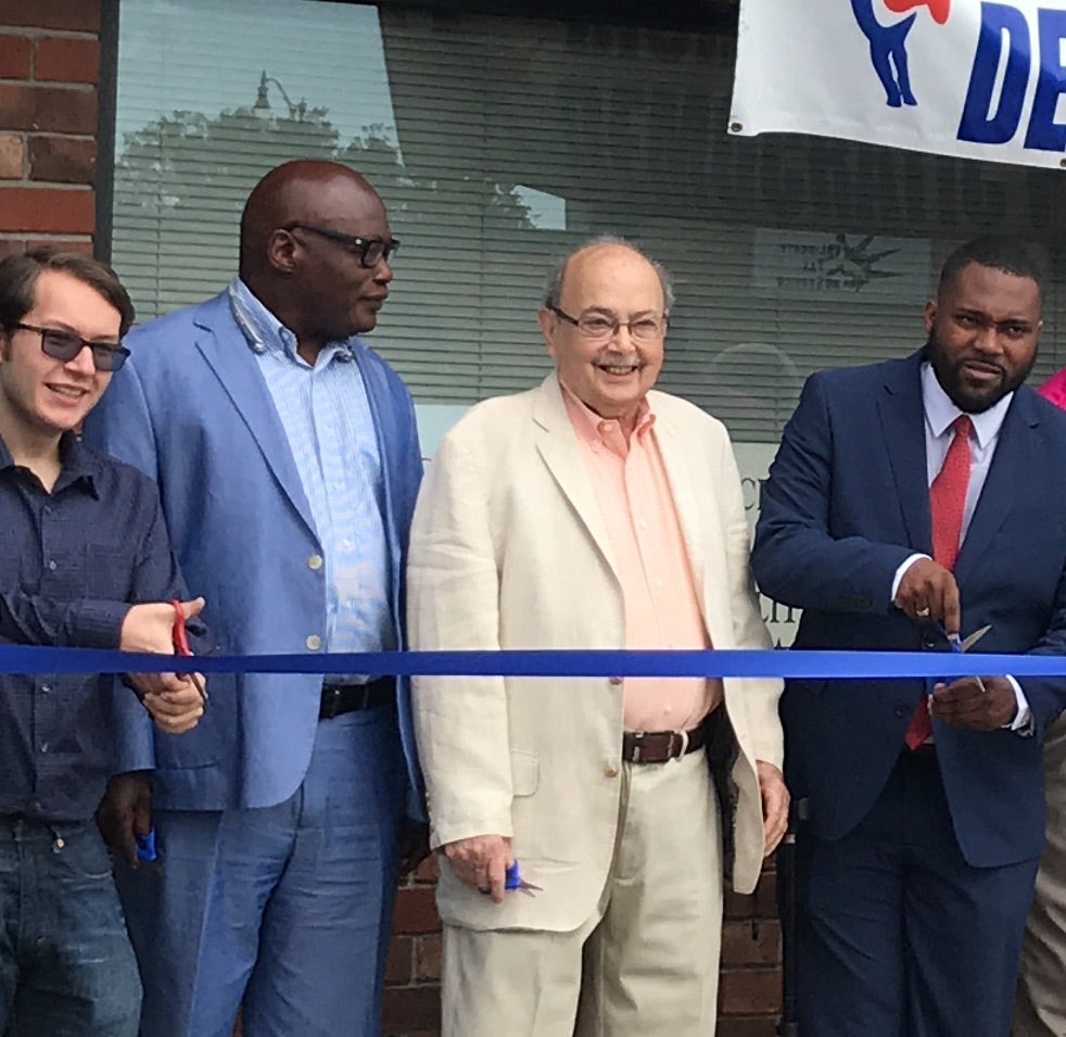 Lowell Greenbaum, center, at the 2019 ribbon cutting for the Richmond County Democratic Party headquarters. Greenbaum, a party heavyweight, died Tuesday at age 94. Staff photo by Susan McCord