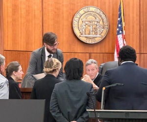 Augusta Circuit Superior Court Judge Jesse Stone speaks with lawyers after jurors had questions during deliberations Friday in the trial of Sandra Dales, left. Staff photo by Susan McCord