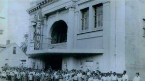 Patrons stand outside Augusta's Lenox Theatre on Ninth Street.  A new apartment complex nearby on Laney-Walker Boulevard, The Lenox, takes its name from the theater. Photo courtesy of city of Augusta