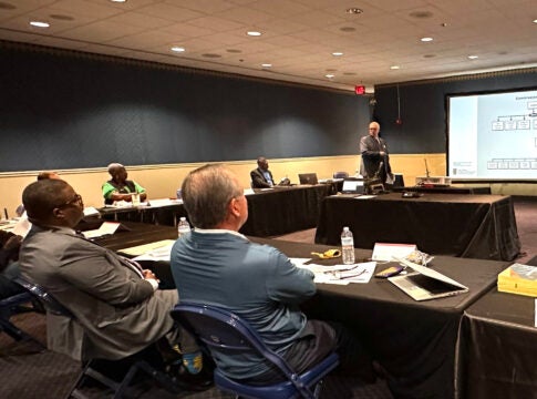 Hardin Watkins, right, a consultant with the Carl Vinson Institute of Government, goes over different government structures at an Augusta Commission retreat Friday. Staff photo by Susan McCord