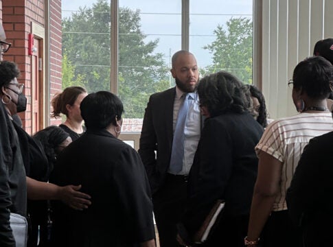 Augusta Circuit District Attorney Jared Williams, center, speaks with family members of Elizabeth Thompson Monday. Staff photo by Susan McCord