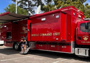 A tiny visitor emerges from a tour of Augusta Fire Department's Mobile Command Unit Saturday at Julian Smith Casino. Staff photo by Susan McCord