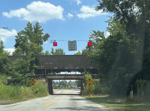 A freight car sits motionless on the tracks on the CSX railroad bridge over Olive Road in Augusta June 13.