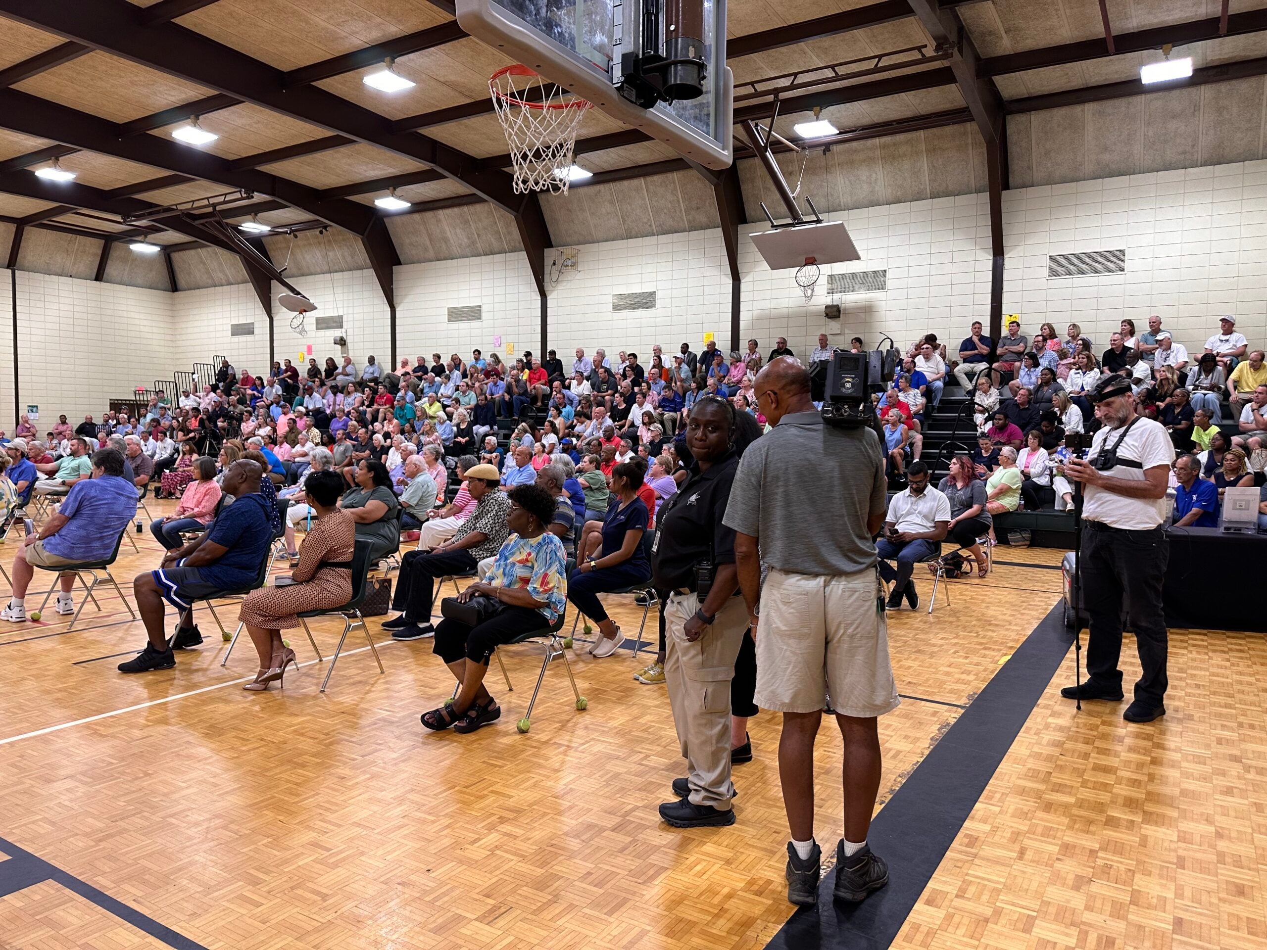 Business owners and neighborhood residents filled the bleachers at Warren Road gym to learn about a new program to help businesses fight crime tied to homelessness. Staff photo by Susan McCord