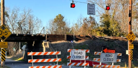 The Olive Road bridge may be closed for months after a driver allegedly knocked a steel beam off the bridge. Staff photo by Susan McCord