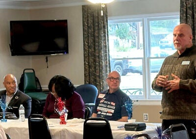 Richmond County Sheriff candidate Eugene Brantley, left, and Augusta Commission candidate Marshall Bedder, center, eye sheriff's candidate Richard Dixon, right, as he speaks to a March 9 gathering of Augusta Republicans. Staff photo by Susan McCord