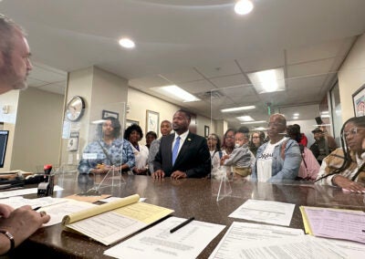 A busy day of Augusta candidate qualifying for Richmond Elections chief Travis Doss, left, included District 1 incumbent Jordan Johnson, center. Staff photo by Susan McCord