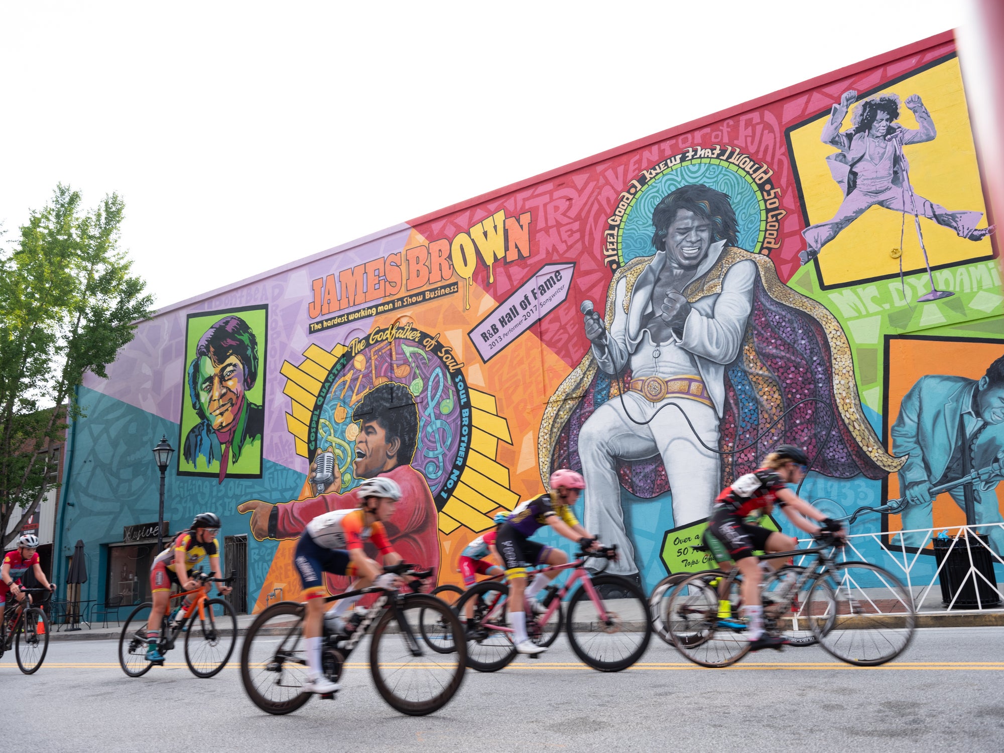 Men Junior 13-14 year old cyclist racing past the James Brown mural in Downtown Augusta.