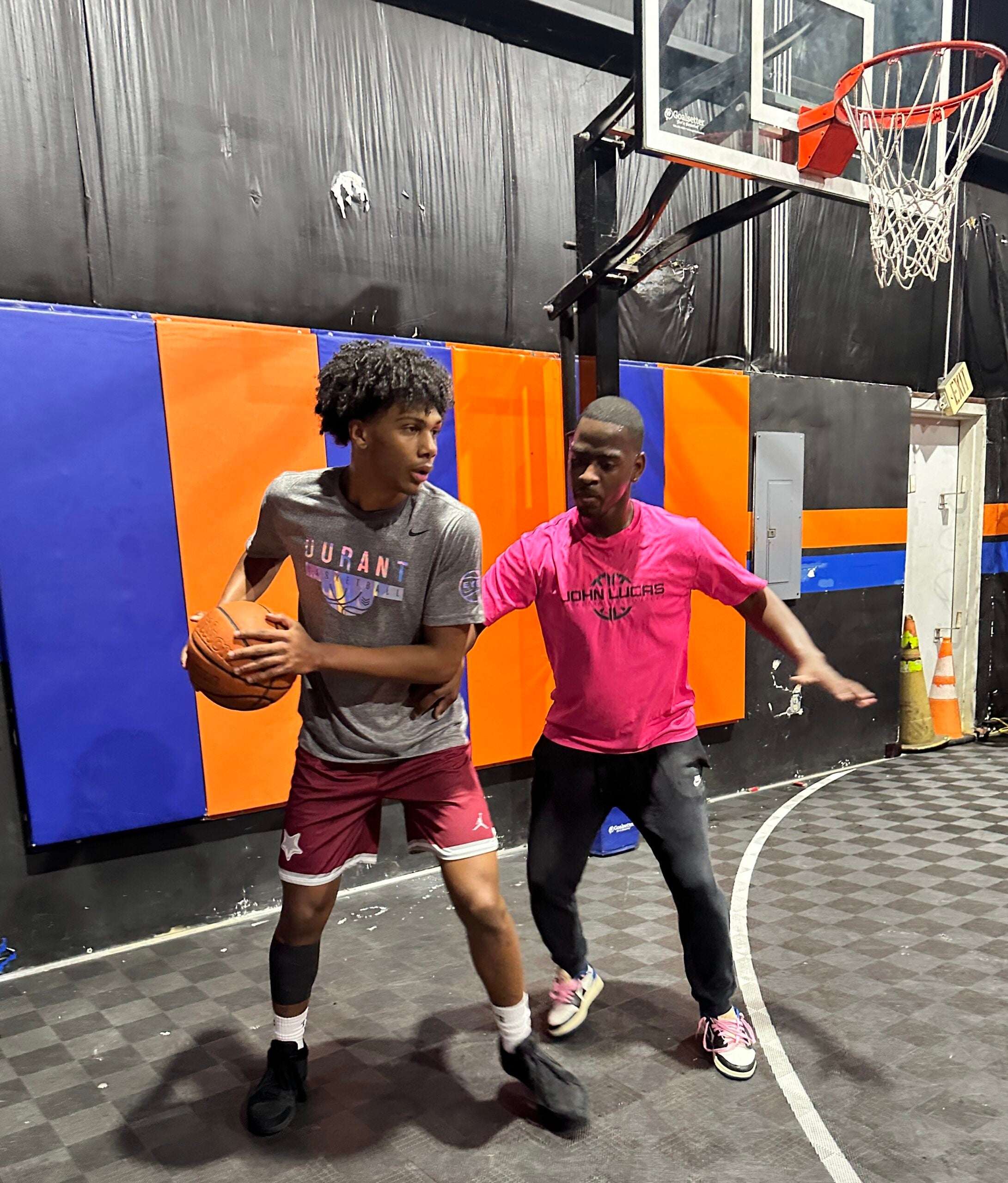 Augusta basketball trainer Darrin Shine, right, works with Washington D.C. top-100 point guard prospect Acaden Lewis during Peach Jam week. Shine has been opening his facility to Peach Jam players from across the country since 2018, and hopes to do more in the future. | Staff photo by Gabriel Stovall.