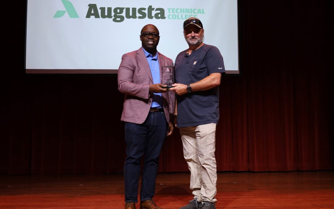 Chris Gay receiving Augusta Tech award