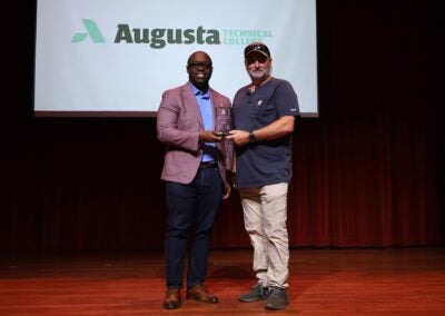 Chris Gay receiving Augusta Tech award