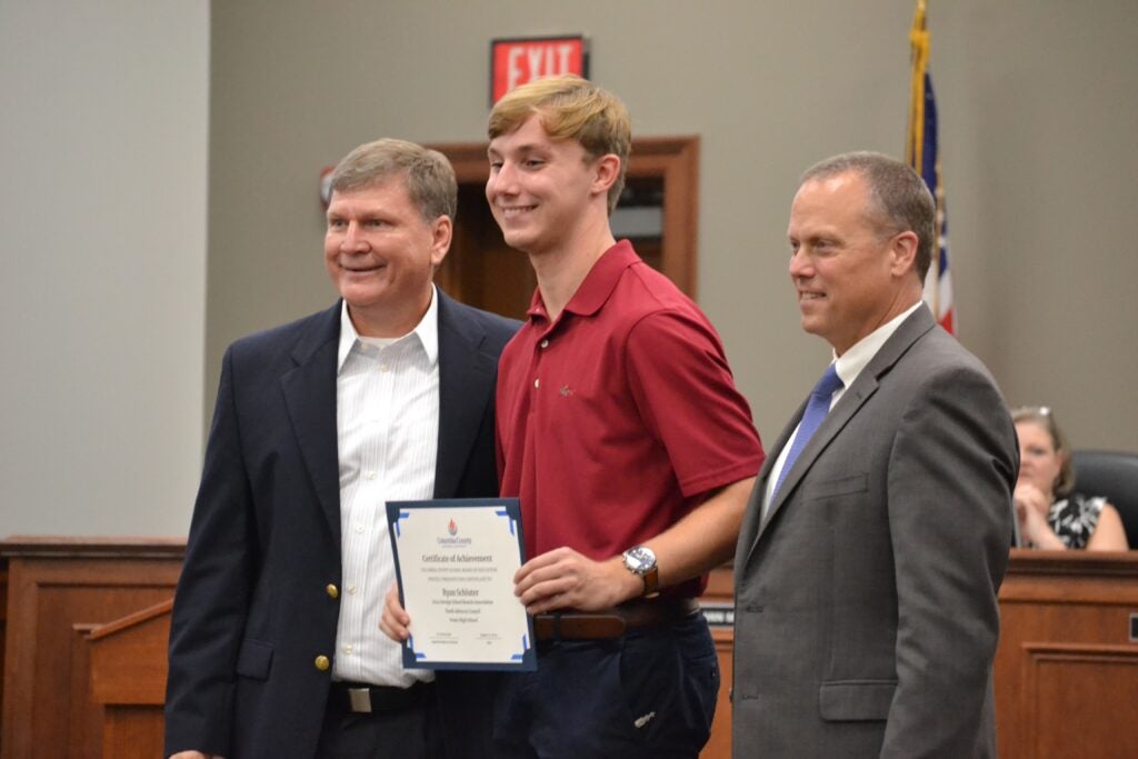 Ryan Schluter was recognized for being invited to join the Georgia Schools Boards Association Youth Advisory Council. He is pictured with EHS Principal Wade White and Superintendent Dr. Steven Flynt. Staff photo by Stephanie Hill