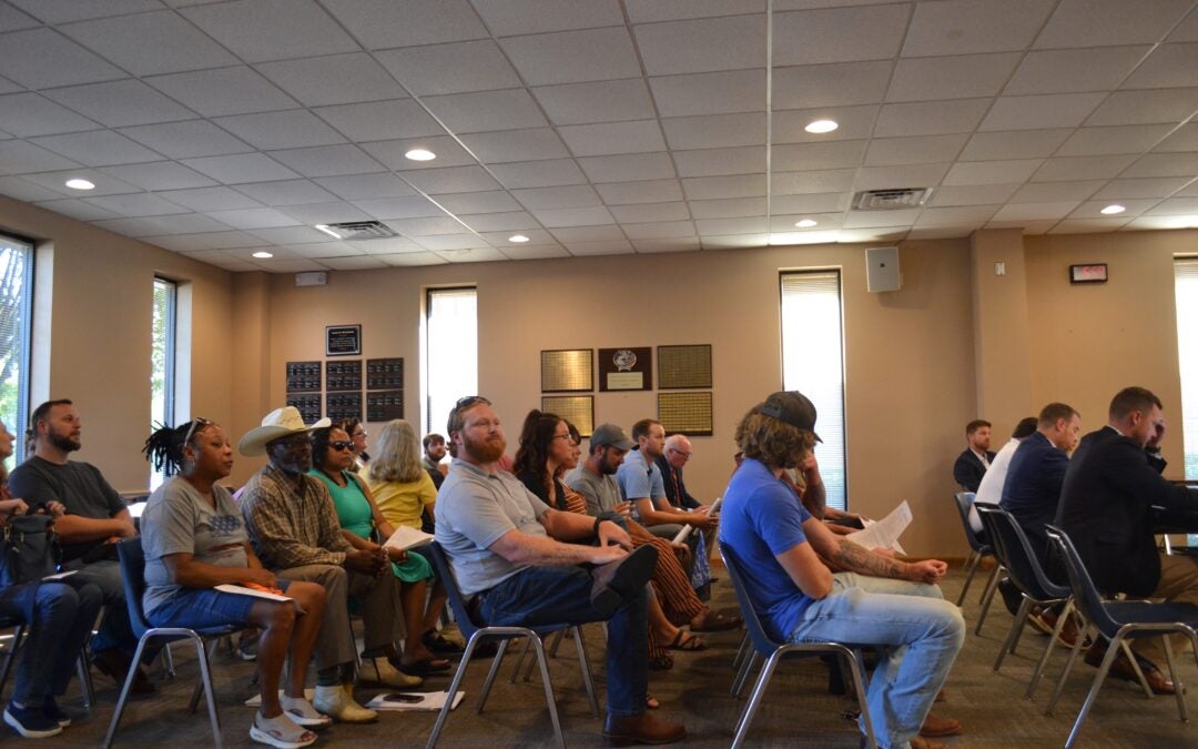 Residents of Rockford Drive and the surrounding area attend the Columbia County Board of Commissioners meeting on Tuesday, Aug. 20 to speak out against the of 5821 Rockford Drive from R-A (Residential Agricultural) to S-1 (Special). Staff photo by Stephanie Hill