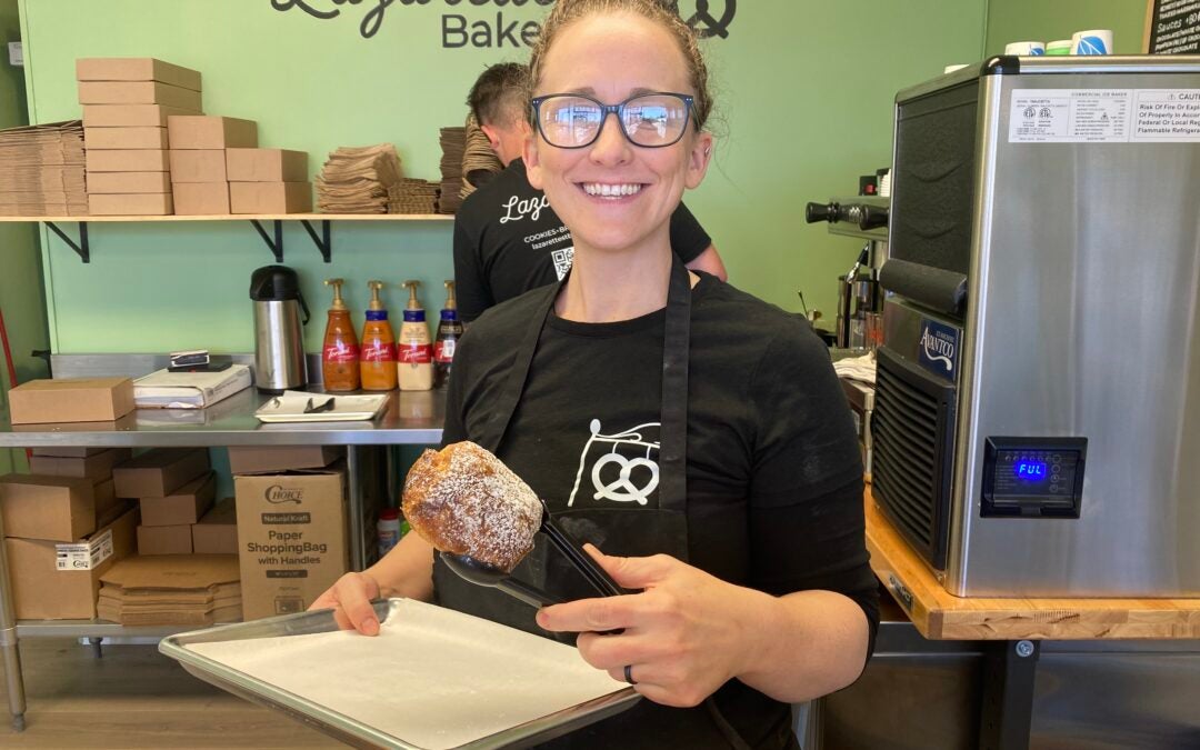 Kyrie Juchemich holds up a chocolate croissant, one of the many items sold at the bakery. Staff photo by Stephanie Hill