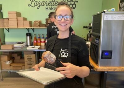 Kyrie Juchemich holds up a chocolate croissant, one of the many items sold at the bakery. Staff photo by Stephanie Hill
