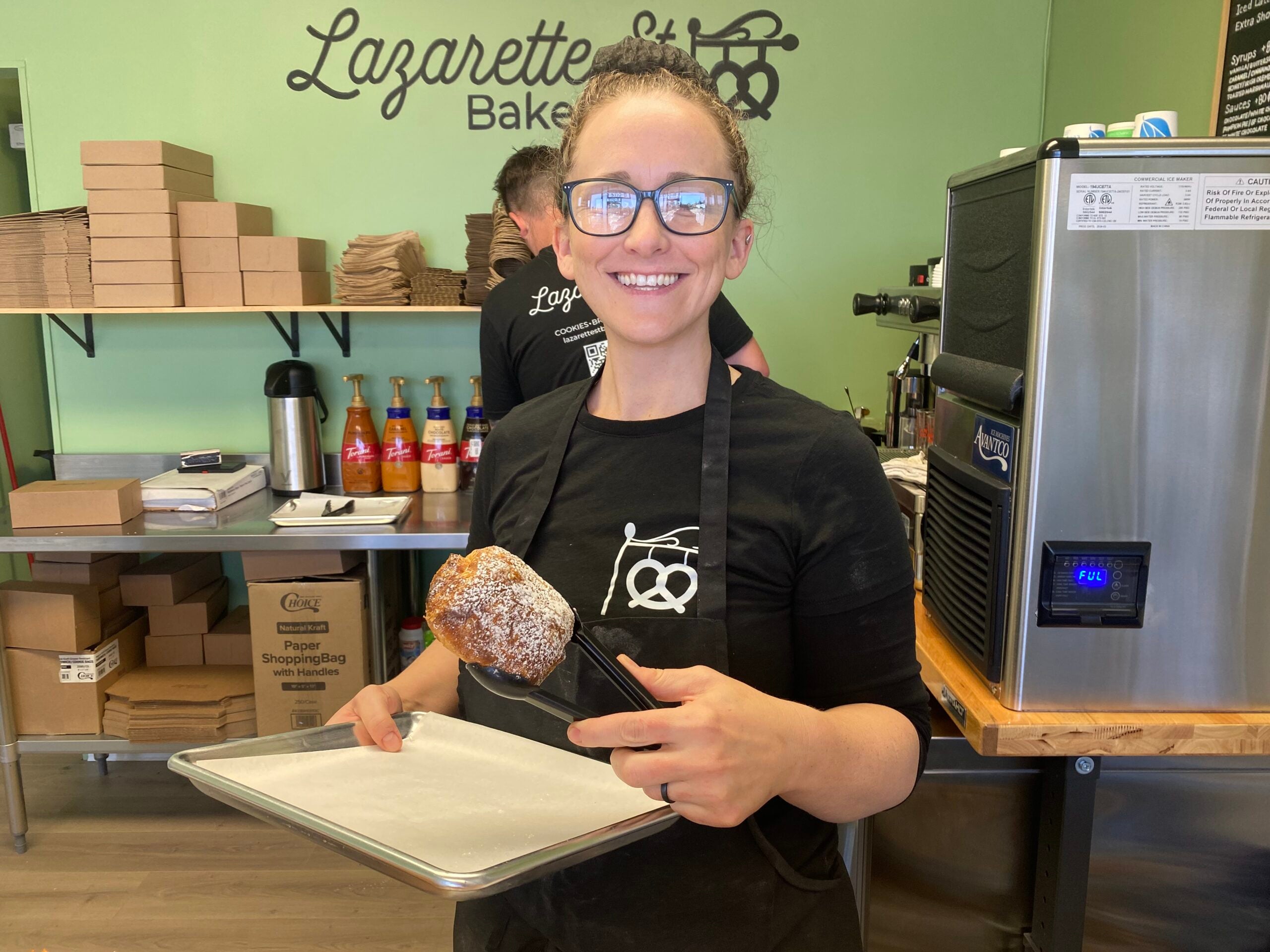 Kyrie Juchemich holds up a chocolate croissant, one of the many items sold at the bakery. Staff photo by Stephanie Hill