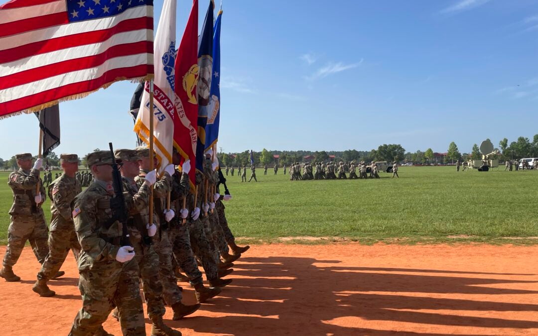 Army soldiers march at Fort Eisenhower change of command at Cyber Center of Excellence