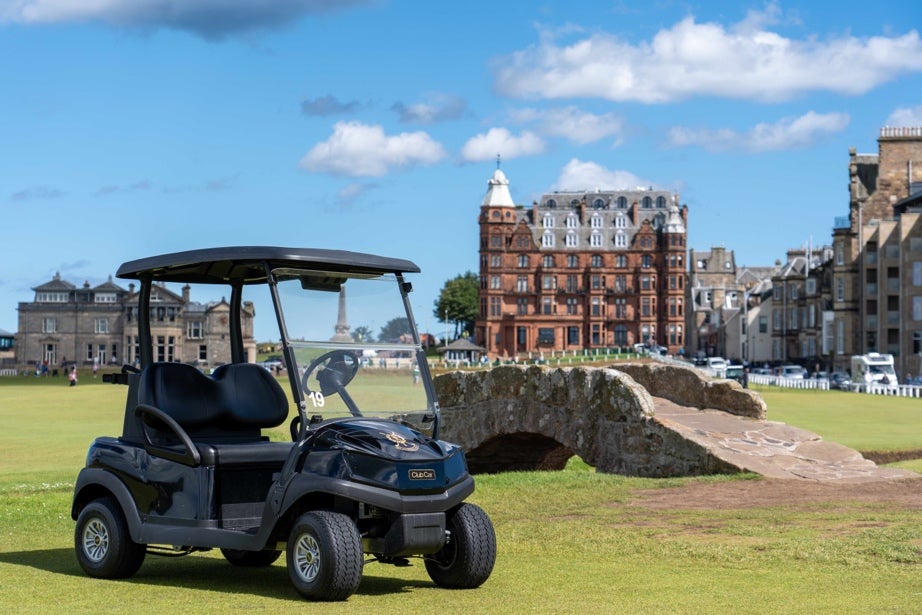 A new Club Car Tempo golf car next to the Swilcan Bridge on the Old Course, St Andrews.
