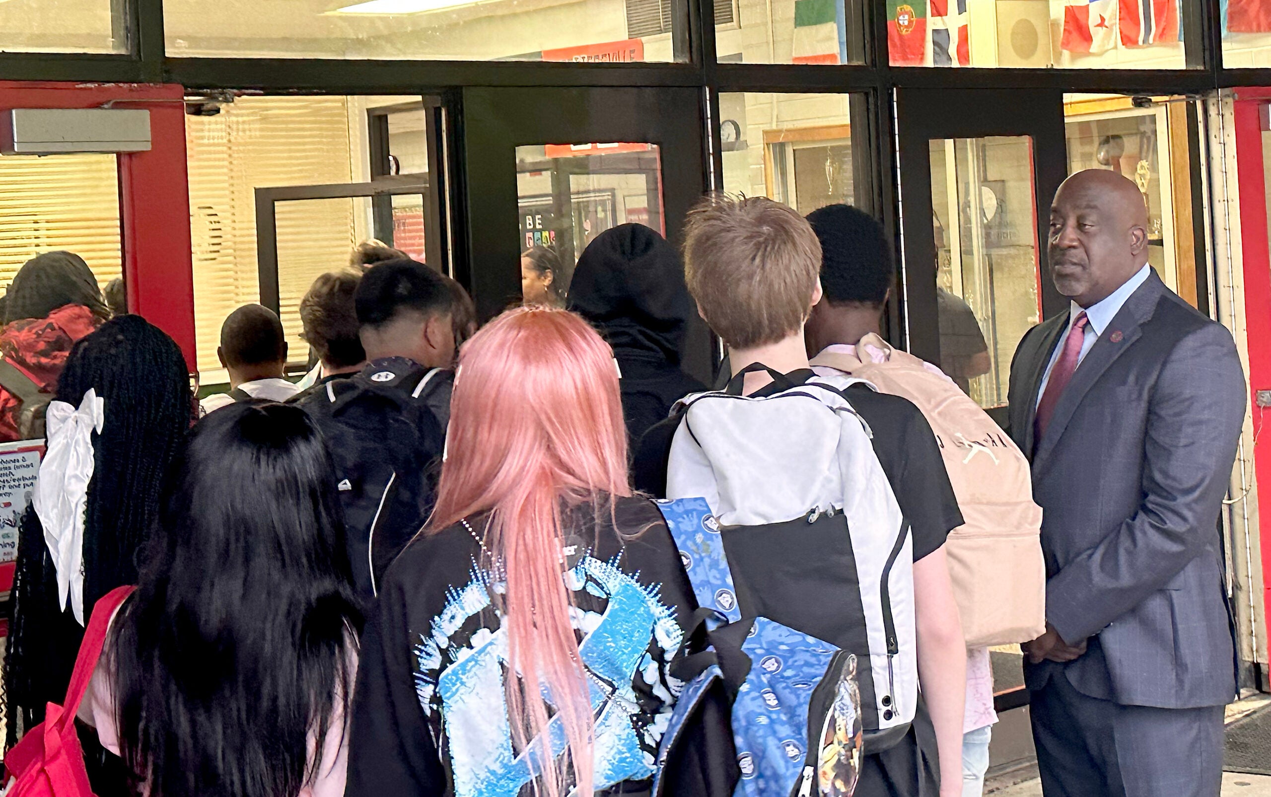 Superintendent Kenneth Bradshaw, right, welcomes students on the first day of school Tuesday at Hephzibah High School. Susan McCord/Staff