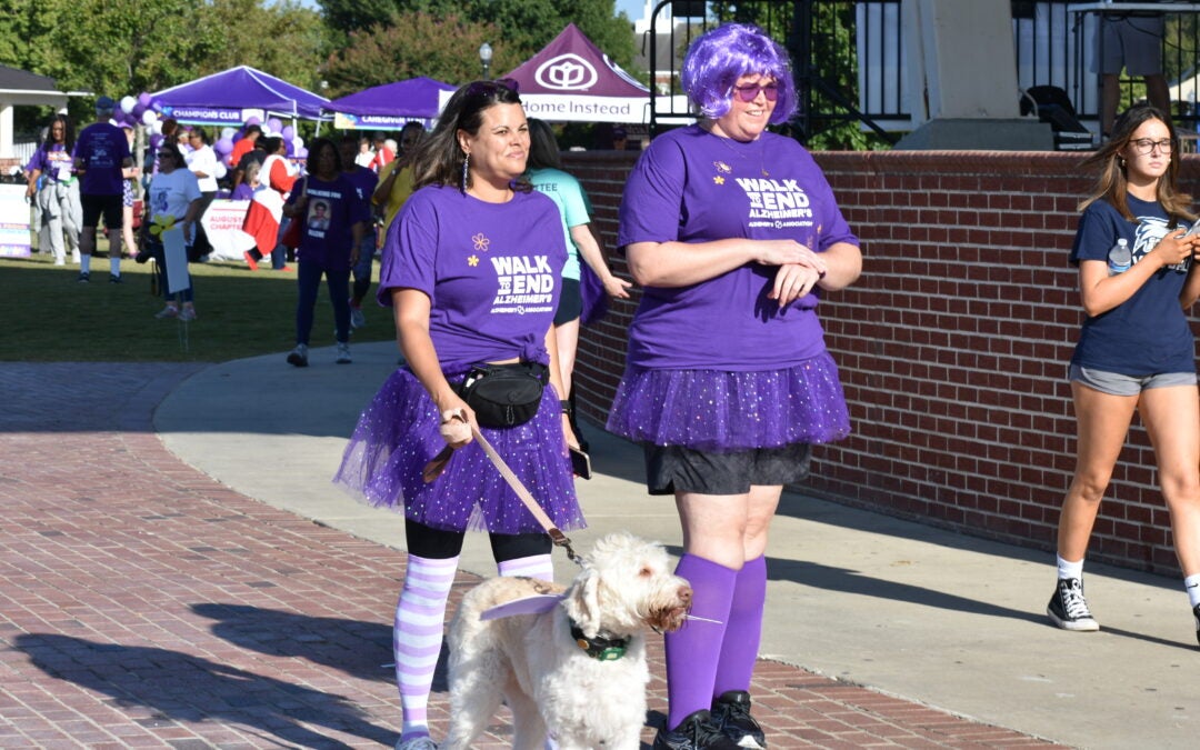 Attendees at the Walk to End Alzheimer's wear purple during a previous walk. Photo courtesy Alzheimer's Association