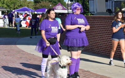 Attendees at the Walk to End Alzheimer's wear purple during a previous walk. Photo courtesy Alzheimer's Association
