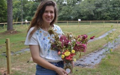 Annie Goble shows off a bouquet of flowers from her flower farm. Staff photo by Stephanie Hill