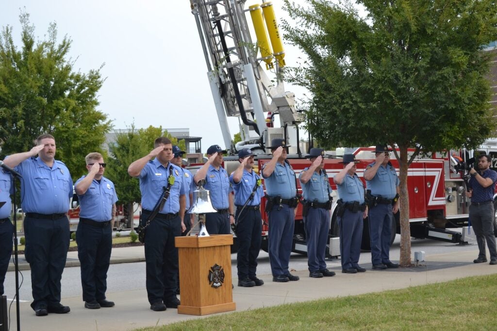 Photo of Public Safety officers saluting