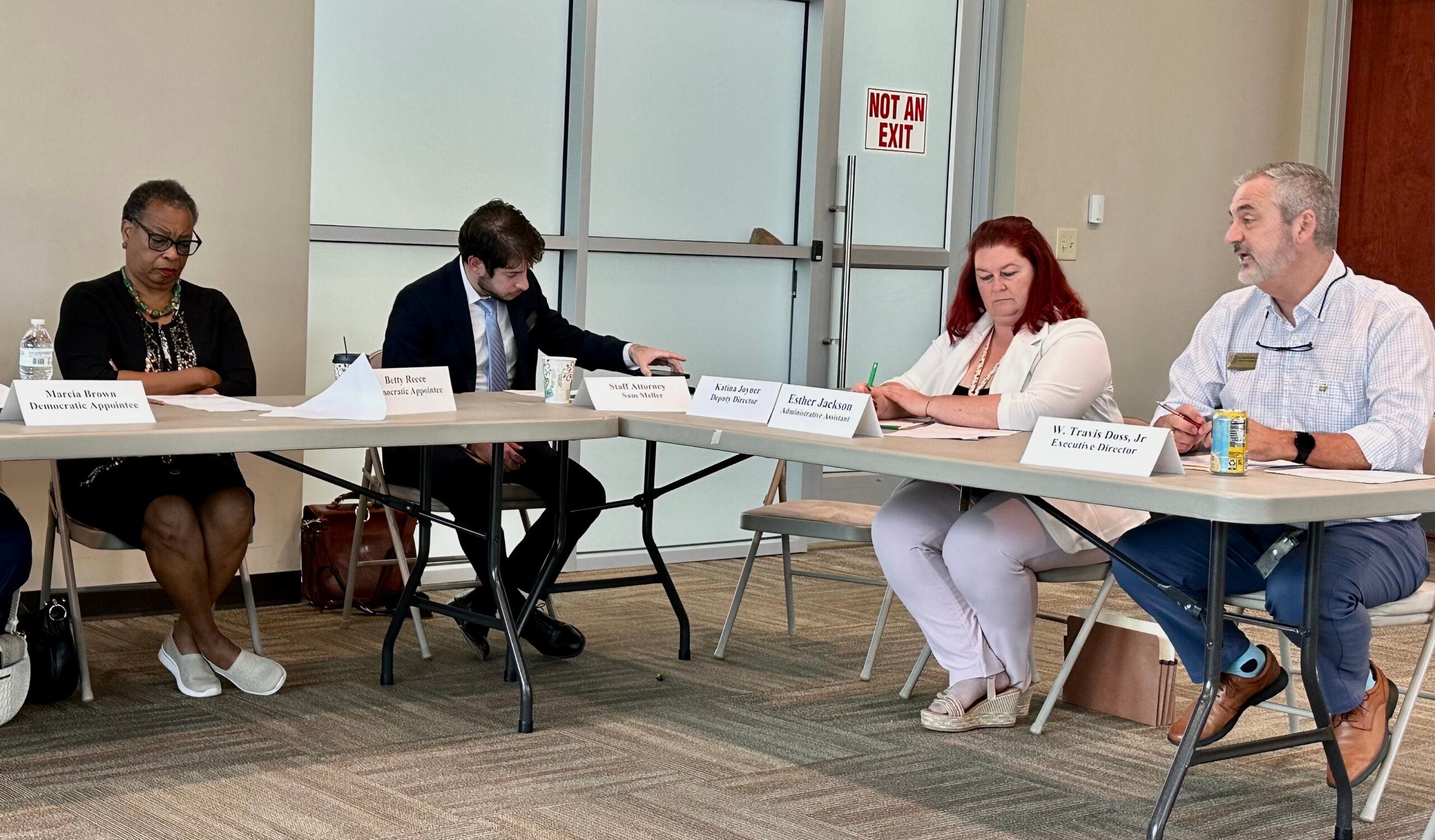 Travis Doss, right, executive director for Richmond County Board of Elections, speaks to board members Monday. From left are Democratic appointee Betty Reece, attorney Sam Mueller and administrative assistant Esther Jackson. Staff photo by Susan McCord