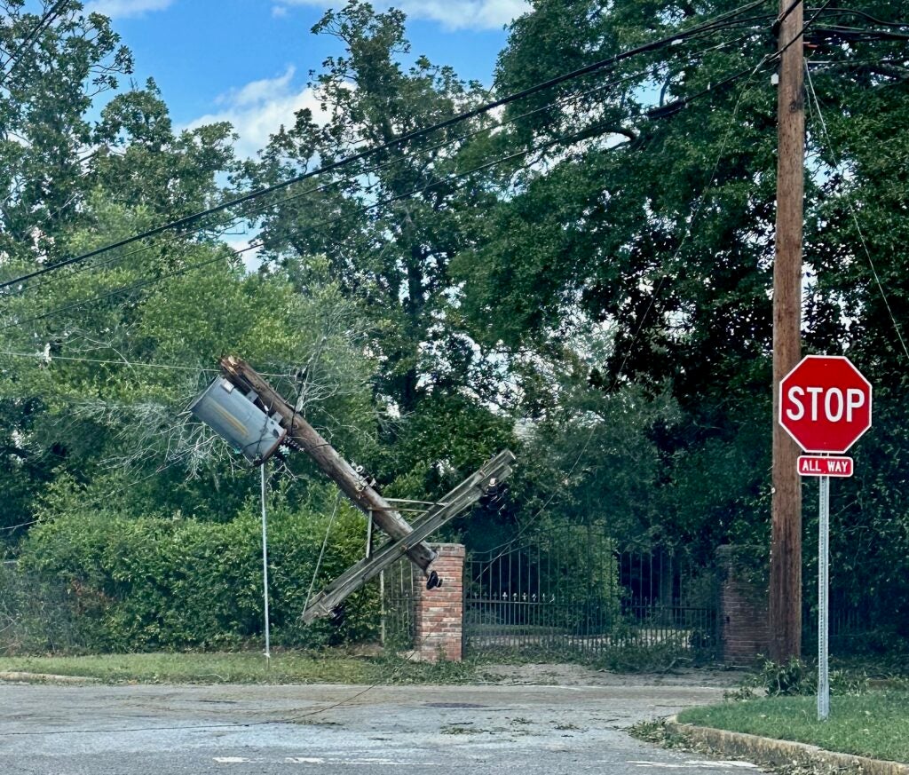 A transformer is suspended in the air on Cumming Road after Hurricane Helene. Staff photo by Susan McCord
