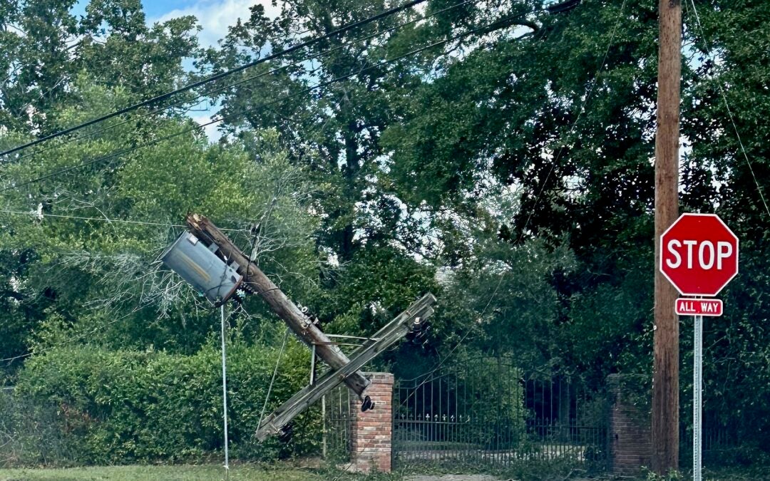 A transformer is suspended in the air on Cumming Road after Hurricane Helene. Staff photo by Susan McCord