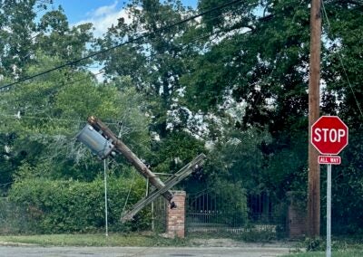 A transformer is suspended in the air on Cumming Road after Hurricane Helene. Staff photo by Susan McCord