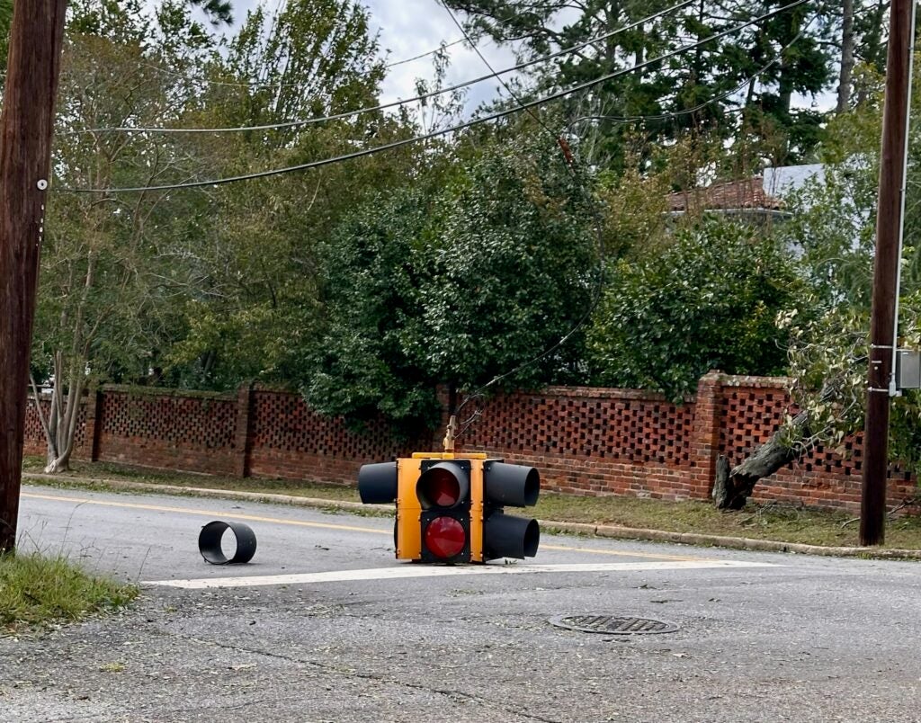 A traffic light lies in Milledge Road after Hurricane Helene. Staff photo by Susan McCord