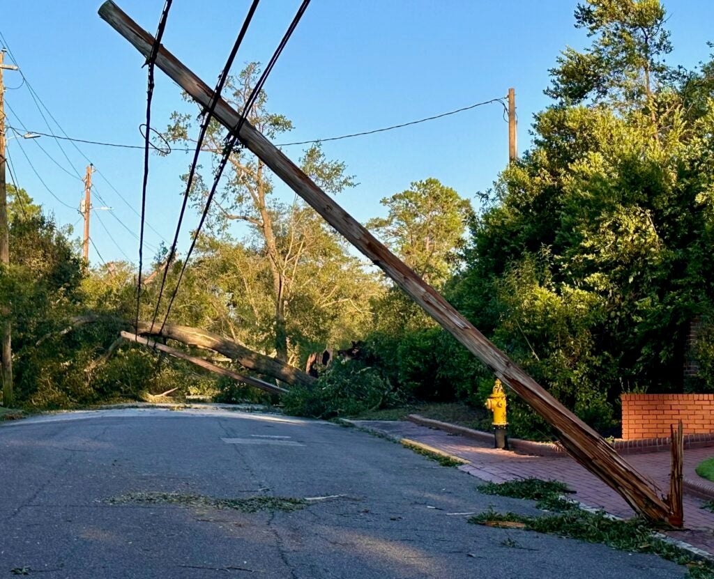 Power poles lean after Hurricane Helene in the Summerville area of Augusta. Staff photo by Susan McCord