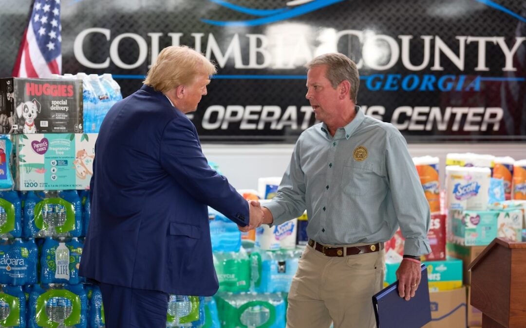 Brian Kemp and Donald Trump shake hands